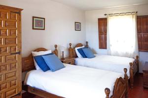 Postel nebo postele na pokoji v ubytování Casa El Colmenero + 19 fotografií