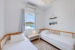Voodi või voodid majutusasutuse Endless Blue from Syros - Fabrika Resort - House 1 toas
