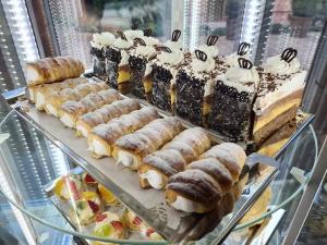a display case filled with different types of desserts at Jolán Pension & Restaurant in Číčov