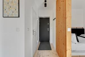 Posteľ alebo postele v izbe v ubytovaní Szeroka Boutique by Downtown Apartments