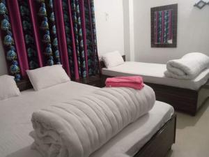 Giường trong phòng chung tại Hotel Kanthak