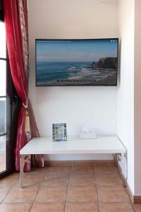 A television and/or entertainment centre at El Rincon - No Stress Holidays