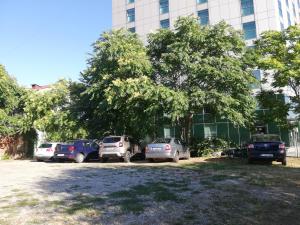 a group of cars parked in front of a building at Hotel CH Bucharest in Bucharest