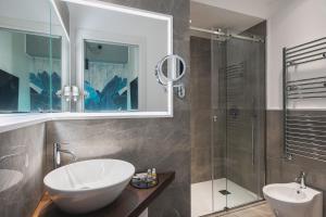 a bathroom with a sink and a shower at Residenze Chamur- Grattacielo in Palermo