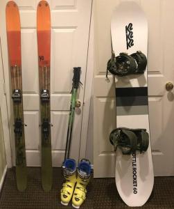 a group of snowboards and skis leaned up against a door at Why Not enjoy while away! in Harrisonburg