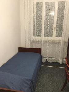 En eller flere senge i et værelse på Casa di Aldo: una casa nel centro di Nervi.