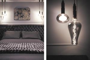 two pictures of a bedroom with a bed and lights at Residenze Chamur- Grattacielo in Palermo