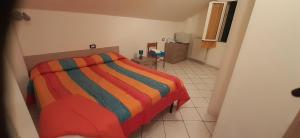Posteľ alebo postele v izbe v ubytovaní affittacamere marosa