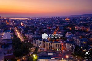 a view of a city at night at Panorama Hotel - Free EV Charging Station in Varna City