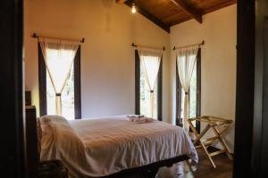 Postel nebo postele na pokoji v ubytování Cotan Ecolodge