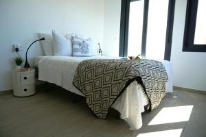 Ліжко або ліжка в номері Villa Puerto Blanco