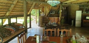 a dining room with a table and chairs in a cabin at The Lapa in Durban