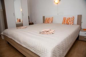 A bed or beds in a room at Apartman Žagar