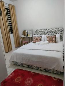 Postel nebo postele na pokoji v ubytování Permai Puteri Homestay Ampang + 17 fotografií