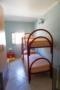 Łóżko lub łóżka w pokoju w obiekcie Casa Vacanza il Ciliegio