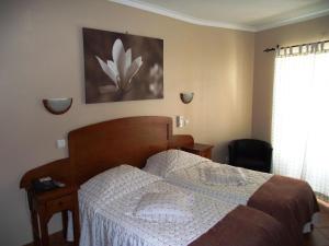 Posteľ alebo postele v izbe v ubytovaní Hotel O Gadanha