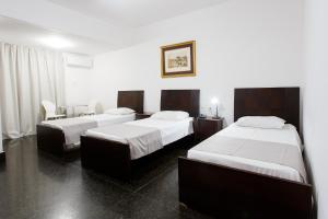 Cama ou camas em um quarto em Savassi Hotel