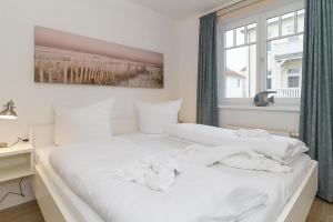 Postel nebo postele na pokoji v ubytování Strandstraße 32 Strandstraße 32-50