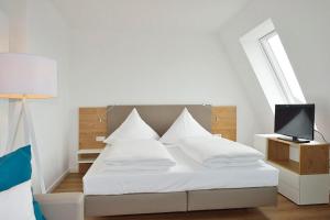 Postel nebo postele na pokoji v ubytování Aparthotel Anna Düne Aparthotel Anna Düne 3-41 + 1 fotografie