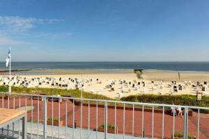 a beach with a lot of people on the sand at Aparthotel Anna Düne Aparthotel Anna Düne 1-23 in Wangerooge