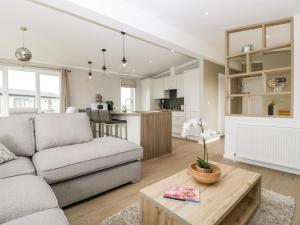 a living room with a couch and a table at Summerdown in Burnham on Sea