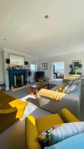 a living room with a couch and a fireplace at Eastfield in Edinburgh