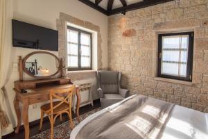A seating area at Polismata - Private Residences