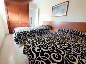Postel nebo postele na pokoji v ubytování gemelos 4 playa levante