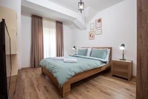 Postel nebo postele na pokoji v ubytování Rest Apartments