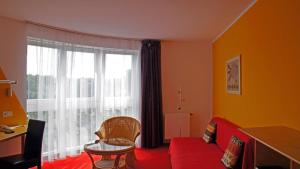 Postel nebo postele na pokoji v ubytování Hotel am Buschkrugpark