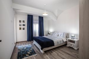 Postel nebo postele na pokoji v ubytování Rest Apartments
