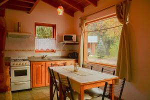 Kuchyň nebo kuchyňský kout v ubytování Apart Hotel del Pellin