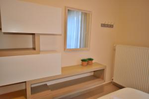 A bed or beds in a room at Mpoulakis Apt 98