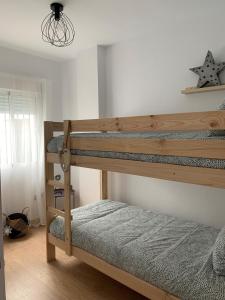 Posteľ alebo postele v izbe v ubytovaní Apartamento Residencial Al Andalus 117, La Barrosa, Chiclana, Incluye parking a unos metros del mar