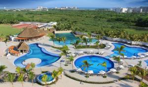 an aerial view of a resort with two pools at Palacio Mundo Imperial Riviera Diamante Acapulco in Acapulco