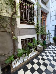 a house with a window and a checkered floor at Le Petit Palais in Buenos Aires