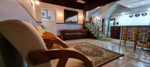 a living room with a couch and a stair case at Copacabana Blue Hotel in Rio de Janeiro