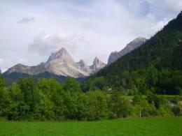 a green field with mountains in the background at Les 3 Marmottes in Lus-la-Croix-Haute