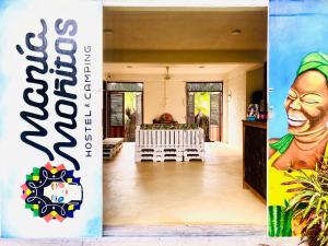 a view of the living room and dining room of a house at Maria Moñitos Hostel in Moñitos