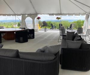 a living room with couches under a tent at Naturluxe & Stars in Watkins Glen