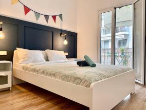 A bed or beds in a room at B&B Boutique Two Bedrooms Apartments