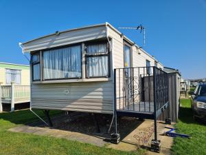 a tiny house on display in a yard at 6 Berth on Sealands Ingoldmells (Torino II) in Ingoldmells