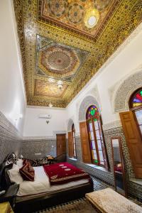 Postel nebo postele na pokoji v ubytování Riad Fes Iline