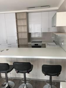 A kitchen or kitchenette at Ádám Guesthouse I.