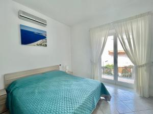 A bed or beds in a room at CASA VACANZE MARIAFRANCESCA