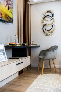 a living room with a desk and a chair at Apartment Emma with sauna in Zagreb