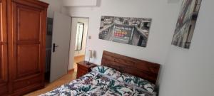 a bedroom with a bed with a poster on the wall at Apartamento en zona céntrica y tranquila. in Pamplona