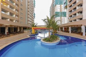 a large swimming pool in the middle of a building at Olímpia Park Resort Enjoy in Olímpia