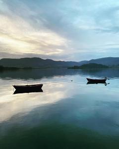 two boats sitting on a large body of water at Vendaval in Santa Marta de Ortigueira