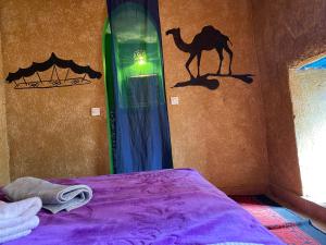 A bed or beds in a room at Dar Yaya